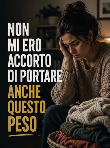 Donna esausta accanto a una pila di biancheria, con la mano sul viso